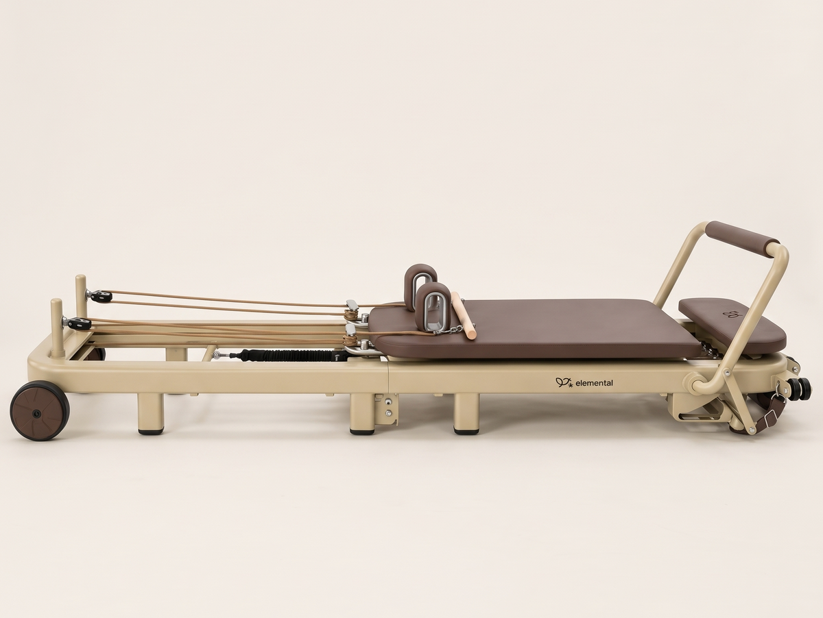 Elemental TerraFold Pilates reformer in Au Sable, shown open in full side profile for home practice