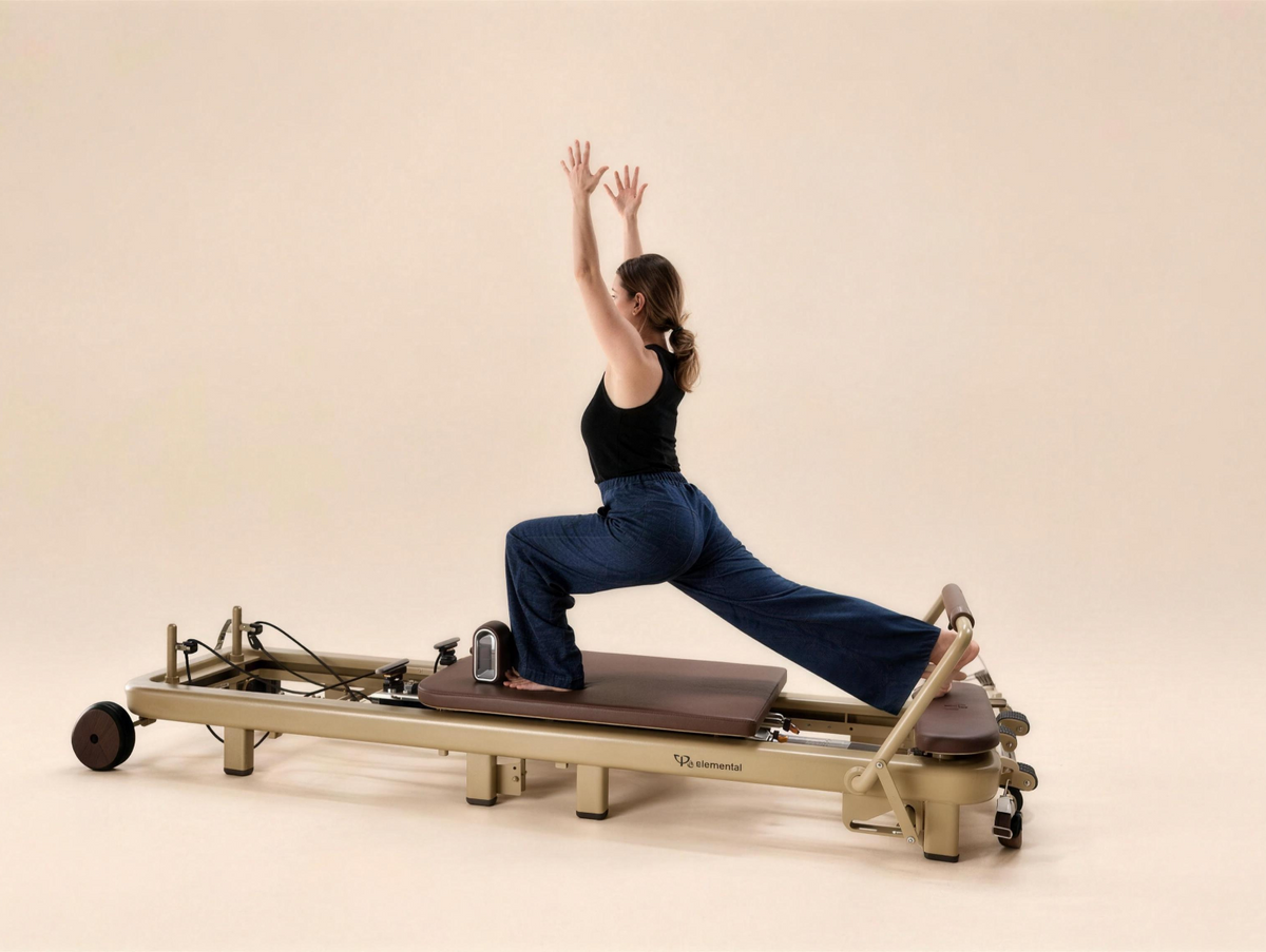 Pilates practitioner in a reformer split variation on the Elemental TerraFold
