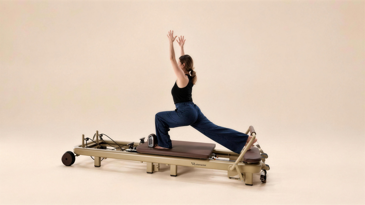 Pilates practitioner in a reformer split variation on the Elemental TerraFold