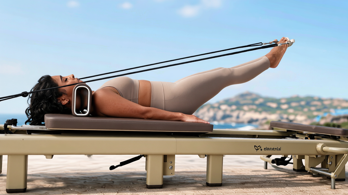 Pilates practitioner moving on the Elemental TerraFold reformer in an editorial outdoor setting