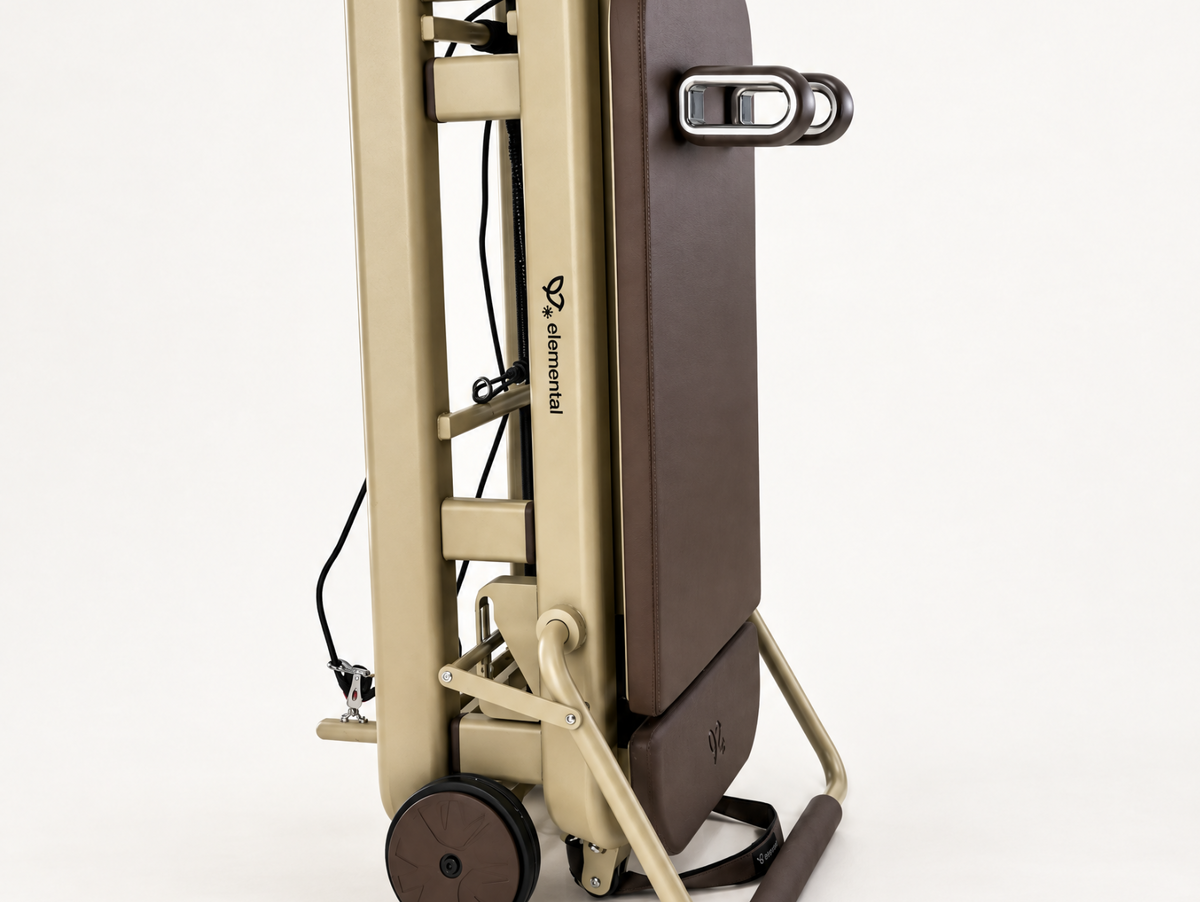 Elemental TerraFold Pilates reformer folded upright for compact storage