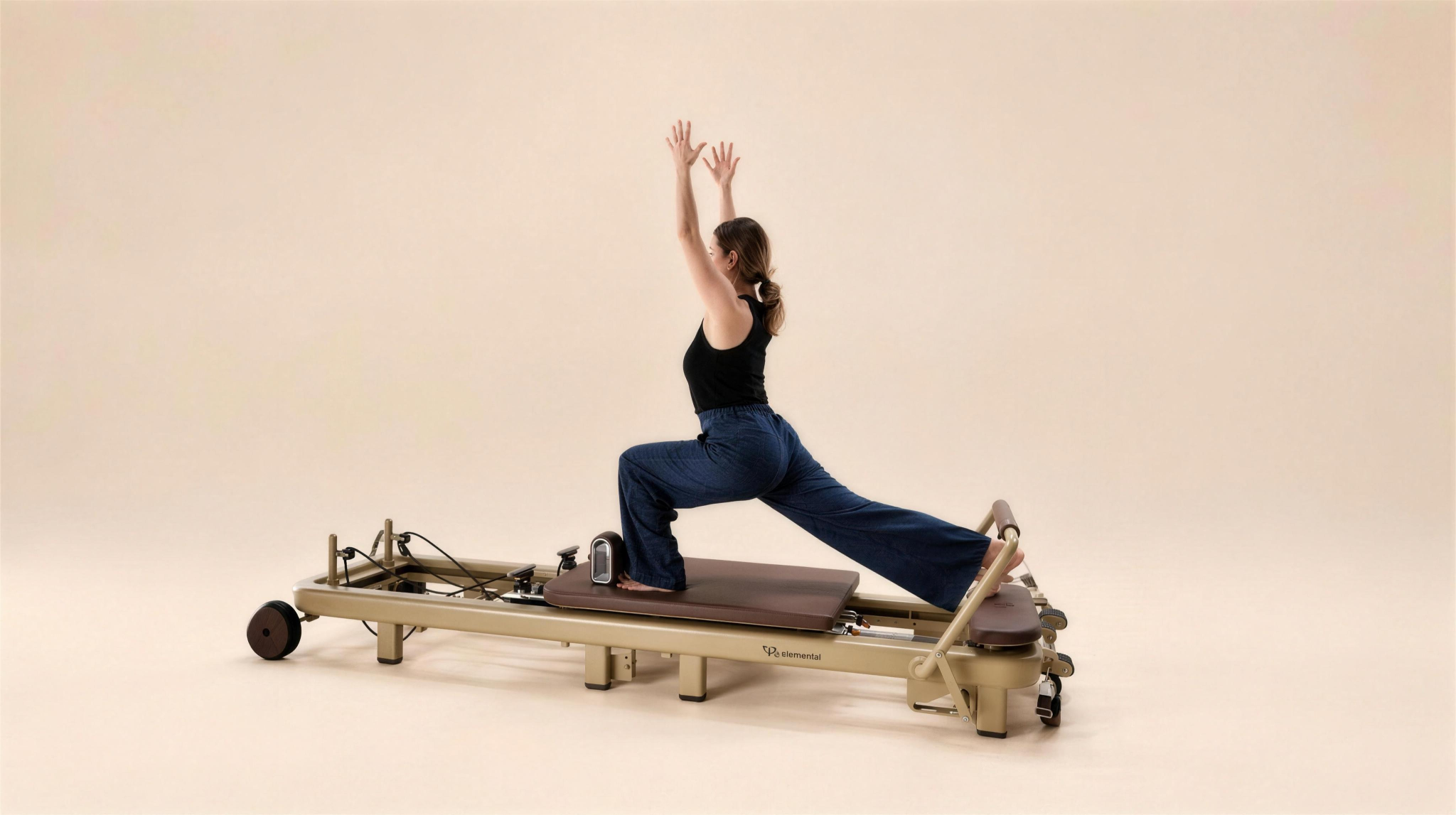Pilates practitioner in a reformer split variation on the Elemental TerraFold