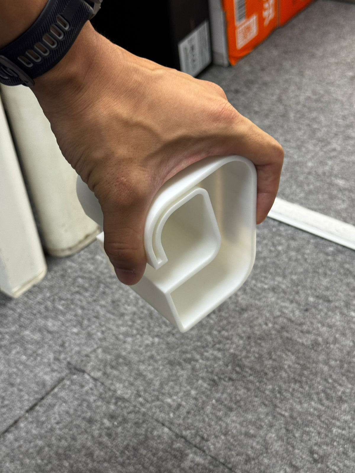 TerraFold ergonomic profile prototype held in the hand during design development